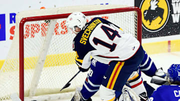 MISSISSAUGA, ON - JANUARY 19: Andrei Svechnikov #14 of the Barrie Colts fires the puck past goalie Emanuel Vella #30 of the Mississauga Steelheads during game action on January 19, 2018 at Hershey Centre in Mississauga, Ontario, Canada. (Photo by Graig Abel/Getty Images)