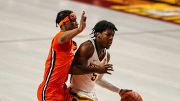 Feb 20, 2021; Minneapolis, Minnesota, USA; Minnesota Golden Gophers guard Marcus Carr (5) drives to the basket while Illinois Fighting Illini guard Trent Frazier (1) defends in the first half at Williams Arena. Mandatory Credit: David Berding-USA TODAY Sports
