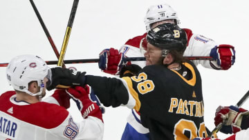 BOSTON - DECEMBER 1: Boston Bruins right wing David Pastrnak (88) goes after Montreal Canadiens left wing Tomas Tatar (90) as defenseman Shea Weber (6) cross checks him in the face during the second period. The Boston Bruins host the Montreal Canadiens in a regular season NHL hockey game at TD Garden in Boston on Dec. 1, 2019. (Photo by Matthew J. Lee/The Boston Globe via Getty Images)