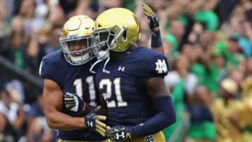 SOUTH BEND, IN - SEPTEMBER 08: Jalen Elliott #21 of the Notre Dame Fighting Irish celebrates his first half interception with Alohi Gilman #11 against the Ball State Cardinals at Notre Dame Stadium on September 8, 2018 in South Bend, Indiana. (Photo by Jonathan Daniel/Getty Images)