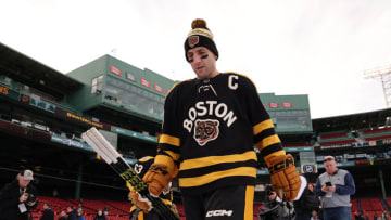 BOSTON, MASSACHUSETTS - JANUARY 01: Patrice Bergeron #37 of the Boston Bruins walks to the ice to practice for the 2023 Winter Classic at Fenway Park on January 01, 2023 in Boston, Massachusetts. (Photo by Gregory Shamus/Getty Images)