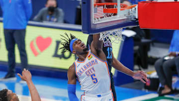 OKC Thunder forward Luguentz Dort (5) goes up for a shot in front of Sacramento Kings center Damian Jones (15): Alonzo Adams-USA TODAY Sports