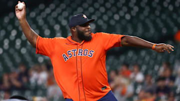 Jul 7, 2021; Houston, Texas, USA; UFC fighter Derrick Lewis throws out a ceremonial first pitch before the game between the Houston Astros and the Oakland Athletics at Minute Maid Park. Mandatory Credit: Troy Taormina-USA TODAY Sports