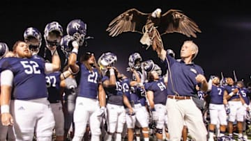 STATESBORO, GA - SEPTEMBER 08: The Georgia Southern Eagles celebrate their win over the University of Massachusetts as handler Steve Hein, hoists Freedom , the team's live mascot on September 8, 2018 in Statesboro, Georgia. (Photo by Chris Thelen/Getty Images)