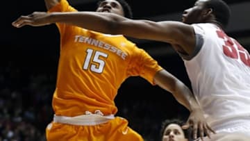 Jan 26, 2016; Tuscaloosa, AL, USA; Tennessee Volunteers guard Detrick Mostella (15) puts up for a shot over Alabama Crimson Tide forward Donta Hall (35) during the first half at Coleman Coliseum. Mandatory Credit: Butch Dill-USA TODAY Sports