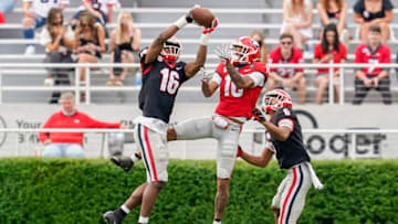 Auburn footballApr 17, 2021; Atlanta, Georgia, USA; Georgia Bulldogs defensive back Lewis Cine (16) intercepts a pass in front of wide receiver Demetris Robertson (16) during the Georgia Spring Game at Sanford Stadium. Mandatory Credit: Dale Zanine-USA TODAY Sports