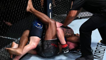 LAS VEGAS, NEVADA - SEPTEMBER 19: In this handout image provided by UFC, Tyron Woodley (R) reacts after suffering a rib injury against Colby Covington in their welterweight bout during the UFC Fight Night event at UFC APEX on September 19, 2020 in Las Vegas, Nevada. (Photo by Chris Unger/Zuffa LLC via Getty Images)