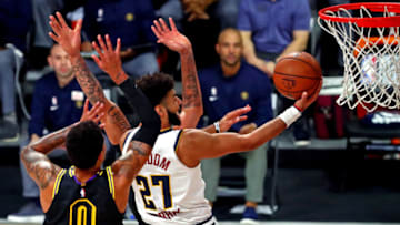 Sep 20, 2020; Lake Buena Vista, Florida, USA; Denver Nuggets guard Jamal Murray (27) shoots the ball against Los Angeles Lakers forward Kyle Kuzma (0) during the second quarter in game two of the Western Conference Finals of the 2020 NBA Playoffs at AdventHealth Arena. Mandatory Credit: Kim Klement-USA TODAY Sports