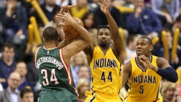 Mar 12, 2015; Indianapolis, IN, USA; Milwaukee Bucks guard Giannis Antetokounmpo (34) is guarded by Indiana Pacers forward Solomon Hill (44) at Bankers Life Fieldhouse. Indiana defeats Milwaukee 109-103 in overtime. Mandatory Credit: Brian Spurlock-USA TODAY Sports