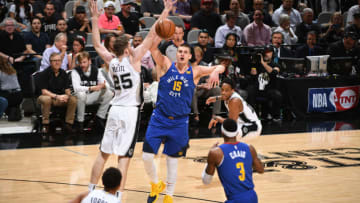 SAN ANTONIO, TX - APRIL 25: Nikola Jokic #15 of the Denver Nuggets passes the ball during the game against the San Antonio Spurs during Game Six of Round One during the 2019 NBA Playoffs on April 25, 2019 at the AT&T Center in San Antonio, Texas. NOTE TO USER: User expressly acknowledges and agrees that, by downloading and/or using this photograph, user is consenting to the terms and conditions of the Getty Images License Agreement. Mandatory Copyright Notice: Copyright 2019 NBAE (Photos by Garrett Ellwood/NBAE via Getty Images)