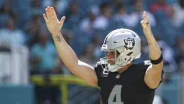MIAMI, FL - SEPTEMBER 23: Derek Carr #4 of the Oakland Raiders celebrates after scoring a touchdown during the third quarter against the Miami Dolphins at Hard Rock Stadium on September 23, 2018 in Miami, Florida. (Photo by Marc Serota/Getty Images)