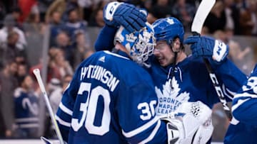 TORONTO, ON - JANUARY 04: Toronto Maple Leafs center Auston Matthews (34) celebrates the win with Toronto Maple Leafs goaltender Michael Hutchinson (30) at the end of the third period in a game between the New York Islanders and the Toronto Maple Leafs on January 04, 2020, at Scotiabank Arena in Toronto, Ontario Canada. (Photo by Nick Turchiaro/Icon Sportswire via Getty Images)