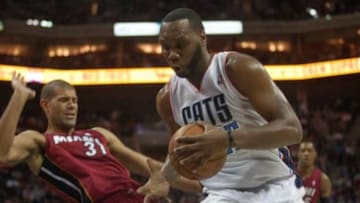 Jan 18, 2014; Charlotte, NC, USA; Charlotte Bobcats center Al Jefferson (25) drives the ball against Miami Heat small forward Shane Battier (31) during the second half at Time Warner Cable Arena. The Heat defeated the Bobcats 104-96 in overtime. Mandatory Credit: Jeremy Brevard-USA TODAY Sports