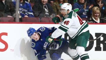 VANCOUVER, BC - OCTOBER 29: Jared Spurgeon #46 of the Minnesota Wild checks Elias Pettersson #40 of the Vancouver Canucks during their NHL game at Rogers Arena October 29, 2018 in Vancouver, British Columbia, Canada. Vancouver won 5-2. (Photo by Jeff Vinnick/NHLI via Getty Images)