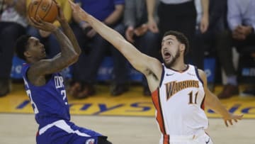 OAKLAND, CA - APRIL 7: Golden State Warriors' Klay Thompson (11) defends against Los Angeles Clippers' Lou Williams (23) in the first quarter at Oracle Arena in Oakland, Calif., on Sunday, April 7, 2019. (Photo by Nhat V. Meyer/MediaNews Group/The Mercury News via Getty Images)