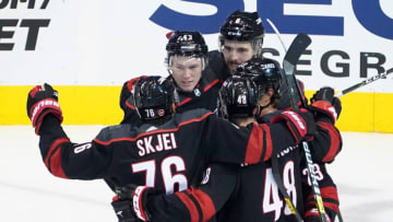 TORONTO, ONTARIO - AUGUST 03: Jordan Martinook #48 of the Carolina Hurricanes celebrates with Morgan Geekie #43, Joel Edmundson #6, and Brady Skjei #76 after scoring a goal against the New York Rangers in Game Two of the Eastern Conference Qualification Round prior to the 2020 NHL Stanley Cup Playoffs at Scotiabank Arena on August 3, 2020 in Toronto, Ontario, Canada. (Photo by Andre Ringuette/Freestyle Photo/Getty Images)