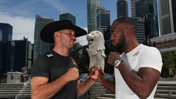 SINGAPORE, SINGAPORE - APRIL 25: Donald Cerrone (L) and Leon Edwards pose for a photo at the Merlion Park, overlooking the financial district, on April 25, 2018 in Singapore. (Photo by Yong Teck Lim/Zuffa LLC)