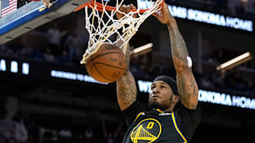 SAN FRANCISCO, CALIFORNIA - NOVEMBER 24: Gary Payton II #0 of the Golden State Warriors slam dunks against the Philadelphia 76ers during the fourth quarter at Chase Center on November 24, 2021 in San Francisco, California. NOTE TO USER: User expressly acknowledges and agrees that, by downloading and or using this photograph, User is consenting to the terms and conditions of the Getty Images License Agreement. (Photo by Thearon W. Henderson/Getty Images)