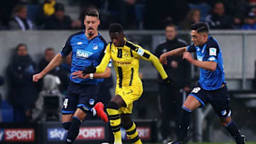 SINSHEIM, GERMANY - DECEMBER 16: Ousmane Dembele of Borussia Dortmund battles for the ball with h14 (L) and Nadiem Amiri of TSG 1899 Hoffenheim during the Bundesliga match between TSG 1899 Hoffenheim and Borussia Dortmund at Wirsol Rhein-Neckar-Arena on December 16, 2016 in Sinsheim, Germany. (Photo by Alex Grimm/Bongarts/Getty Images)