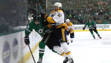 DALLAS, TEXAS - APRIL 17: Jason Dickinson #16 of the Dallas Stars skates the puck against Ryan Johansen #92 of the Nashville Predators in the third period of Game Three of the Western Conference First Round during the 2019 NHL Stanley Cup Playoffs at American Airlines Center on April 17, 2019 in Dallas, Texas. (Photo by Ronald Martinez/Getty Images)