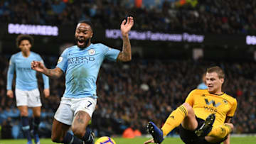 MANCHESTER, ENGLAND - JANUARY 14: Raheem Sterling of Manchester City is tackled by Ryan Bennett of Wolverhampton Wanderers and is awarded a penalty during the Premier League match between Manchester City and Wolverhampton Wanderers at Etihad Stadium on January 14, 2019 in Manchester, United Kingdom. (Photo by Michael Regan/Getty Images)