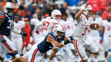 Auburn football linebacker Wesley Steiner (32) stops Houston quarterback Clayton Tune (3) after a gain during the Birmingham Bowl at Protective Stadium in Birmingham, Ala., on Tuesday December 28, 2021.Bham18