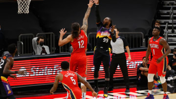 Jae Crowder #99 of the Phoenix Suns attempts a shot over Steven Adams #12 of the New Orleans Pelicans (Photo by Christian Petersen/Getty Images)
