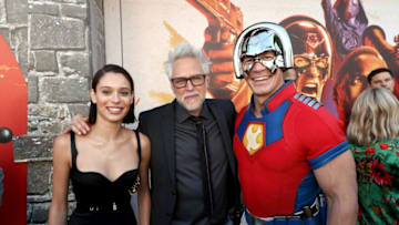 LOS ANGELES, CALIFORNIA - AUGUST 02: (L-R) Daniela Melchior, James Gunn, and John Cena attend the Warner Bros. premiere of "The Suicide Squad" at Regency Village Theatre on August 02, 2021 in Los Angeles, California. (Photo by Kevin Winter/Getty Images)