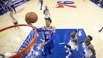 PHILADELPHIA, PA - OCTOBER 30: Matisse Thybulle #22 of the Philadelphia 76ers attempts a lay up against Robert Covington #33 and Treveon Graham #12 of the Minnesota Timberwolves. (Photo by Mitchell Leff/Getty Images)