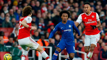 Chelsea's Brazilian midfielder Willian (C) takes on Arsenal's Gabonese striker Pierre-Emerick Aubameyang (R) and Arsenal's Brazilian defender David Luiz (L) during the English Premier League football match between Arsenal and Chelsea at the Emirates Stadium in London on December 29, 2019. (Photo by Ian KINGTON / IKIMAGES / AFP) / RESTRICTED TO EDITORIAL USE. No use with unauthorized audio, video, data, fixture lists, club/league logos or 'live' services. Online in-match use limited to 45 images, no video emulation. No use in betting, games or single club/league/player publications. (Photo by IAN KINGTON/IKIMAGES/AFP via Getty Images)