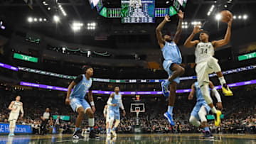 MILWAUKEE, WISCONSIN - JANUARY 01: Giannis Antetokounmpo #34 of the Milwaukee Bucks is defended by Josh Okogie #20 of the Minnesota Timberwolves during a game at Fiserv Forum on January 01, 2020 in Milwaukee, Wisconsin. NOTE TO USER: User expressly acknowledges and agrees that, by downloading and or using this photograph, User is consenting to the terms and conditions of the Getty Images License Agreement. (Photo by Stacy Revere/Getty Images)