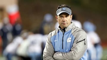 Nov 20, 2014; Durham, NC, USA; North Carolina Tar Heels head coach Larry Fedora watches his team warmup before their game against the Duke Blue Devils at Wallace Wade Stadium. Mandatory Credit: Mark Dolejs-USA TODAY Sports