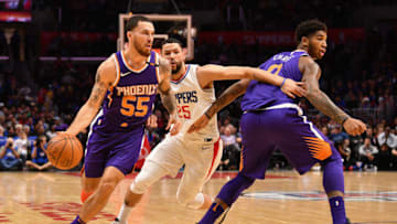 LOS ANGELES, CA - DECEMBER 20: Phoenix Suns Guard Mike James (55) drives past Los Angeles Clippers Guard Austin Rivers (25) with the help of a screen from Phoenix Suns Forward Marquese Chriss (0) during an NBA game between the Phoenix Suns and the Los Angeles Clippers on December 20, 2017 at STAPLES Center in Los Angeles, CA. (Photo by Brian Rothmuller/Icon Sportswire via Getty Images)