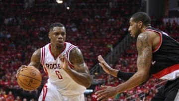 Apr 20, 2014; Houston, TX, USA; Houston Rockets forward Terrence Jones (6) drives the ball during the third quarter as Portland Trail Blazers forward LaMarcus Aldridge (12) defends in game one during the first round of the 2014 NBA Playoffs at Toyota Center. Mandatory Credit: Troy Taormina-USA TODAY Sports