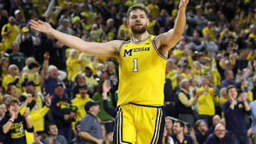ANN ARBOR, MICHIGAN - FEBRUARY 18: Hunter Dickinson #1 of the Michigan Wolverines reacts after a late second half three point basket against the Michigan State Spartans at Crisler Arena on February 18, 2023 in Ann Arbor, Michigan. Michigan won the game 84-72. (Photo by Gregory Shamus/Getty Images)