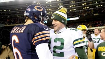 Dec 29, 2013; Chicago, IL, USA; Chicago Bears quarterback Jay Cutler (6) and Green Bay Packers quarterback Aaron Rodgers (12) meet at midfield after the game at Soldier Field. The Green Bay Packers win 33-28. Mandatory Credit: Mike DiNovo-USA TODAY Sports