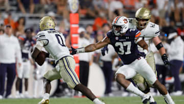 Auburn footballSep 4, 2021; Auburn, Alabama, USA; Akron Zips quarterback DJ Irons (0) avoids Auburn Tigers edge Romello Height (37) during the fourth quarter at Jordan-Hare Stadium. Mandatory Credit: John Reed-USA TODAY Sports