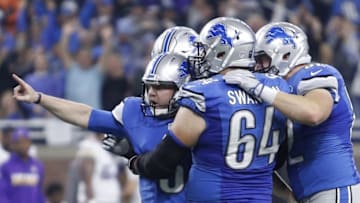 Nov 24, 2016; Detroit, MI, USA; Detroit Lions kicker Matt Prater (5) celebrates with center Travis Swanson (64) and teammates after kicking the game winning field goal as time expired in the fourth quarter against the Minnesota Vikings at Ford Field. The Lions won 16-13. Mandatory Credit: Raj Mehta-USA TODAY Sports