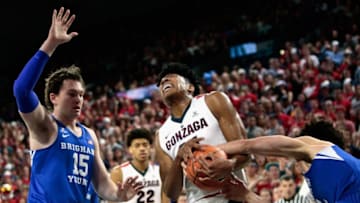 SPOKANE, WA - FEBRUARY 03: Rui Hachimura #21 of the Gonzaga Bulldogs battles for possession of the ball against Elijah Bryant #3 of the BYU Cougars while BYU's Payton Dastrup #15 looks on during the second half at McCarthey Athletic Center on February 3, 2018 in Spokane, Washington. Gonzaga defeated BYU 68-60. (Photo by William Mancebo/Getty Images)