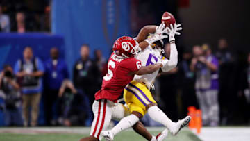 ATLANTA, GEORGIA - DECEMBER 28: Wide receiver Terrace Marshall Jr. #6 of the LSU Tigers has a pass broken up by cornerback Tre Brown #6 of the Oklahoma Sooners during the Chick-fil-A Peach Bowl at Mercedes-Benz Stadium on December 28, 2019 in Atlanta, Georgia. (Photo by Gregory Shamus/Getty Images)