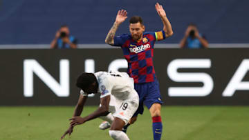Lionel Messi, Barcelona and Alphonso Davies, Bayern Munich. (Photo by RAFAEL MARCHANTE/POOL/AFP via Getty Images)
