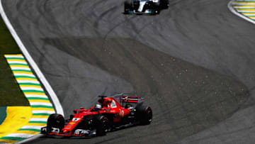 SAO PAULO, BRAZIL - NOVEMBER 12: Sebastian Vettel of Germany driving the (5) Scuderia Ferrari SF70H leads Valtteri Bottas driving the (77) Mercedes AMG Petronas F1 Team Mercedes F1 WO8 on track during the Formula One Grand Prix of Brazil at Autodromo Jose Carlos Pace on November 12, 2017 in Sao Paulo, Brazil. (Photo by Dan Istitene/Getty Images)