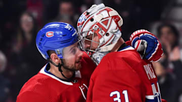 MONTREAL, QC - MARCH 12: Tomas Tatar #90 of the Montreal Canadiens congratulates goaltender Carey Price #31 for setting a franchise record with 315 victories surpassing Jacques Plante against the Detroit Red Wings during the NHL game at the Bell Centre on March 12, 2019 in Montreal, Quebec, Canada. (Photo by Minas Panagiotakis/Getty Images)