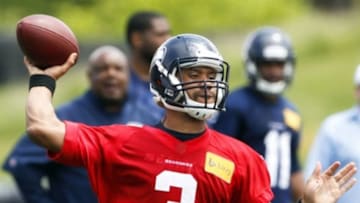 May 27, 2014; Renton, WA, USA; Seattle Seahawks quarterback Russell Wilson (3) passes during organized team activities at the Virginia Mason Athletic Center. Mandatory Credit: Joe Nicholson-USA TODAY Sports