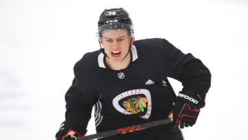 CHICAGO, ILLINOIS - SEPTEMBER 14: Connor Bedard #98 of the Chicago Blackhawks reacts during a drill at Prospect Camp practice at Fifth Third Arena on September 14, 2023 in Chicago, Illinois. (Photo by Michael Reaves/Getty Images)