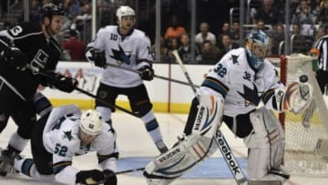 Apr 28, 2014; Los Angeles, CA, USA; San Jose Sharks goalie Alex Stalock (32) attempts to catch a deflected shot against the Los Angeles Kings during the second period in game six of the first round of the 2014 Stanley Cup Playoffs at Staples Center. Mandatory Credit: Kelvin Kuo-USA TODAY Sports