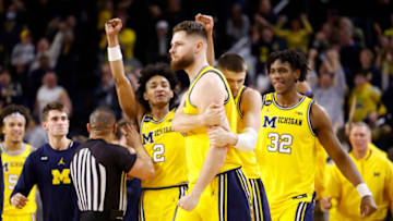 Feb 26, 2023; Ann Arbor, Michigan, USA; Michigan Wolverines center Hunter Dickinson (1) is congratulated by teammates after making a three point basket to tie the game against the Wisconsin Badgers at Crisler Center. Mandatory Credit: Rick Osentoski-USA TODAY Sports