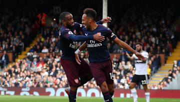 LONDON, ENGLAND - OCTOBER 07: Pierre-Emerick Aubameyang of Arsenal celebrates with teammate Alexandre Lacazette after scoring his team's fourth goal during the Premier League match between Fulham FC and Arsenal FC at Craven Cottage on October 7, 2018 in London, United Kingdom. (Photo by Catherine Ivill/Getty Images)