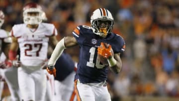 Oct 22, 2016; Auburn, AL, USA; Auburn Tigers running back Stanton Truitt (10) gets past Arkansas Razorback defenders and scores a touchdown during the fourth quarter at Jordan Hare Stadium. The Tigers beat the Razorbacks 56-3. Mandatory Credit: John Reed-USA TODAY Sports