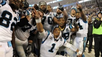 Jan 3, 2015; Charlotte, NC, USA; Carolina Panthers quarterback Cam Newton (1) and the Carolina Panthers celebrate after beating the Arizona Cardinals in the 2014 NFC Wild Card playoff football game at Bank of America Stadium. Mandatory Credit: Sam Sharpe-USA TODAY Sports